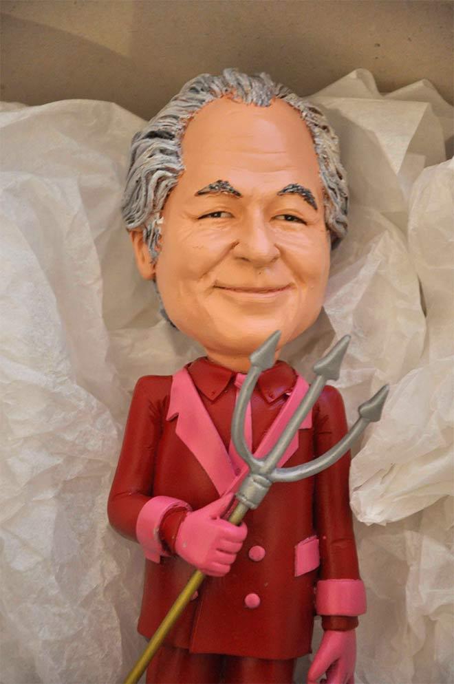 Bernie Madoff-doll with silver hair and a pitchfork