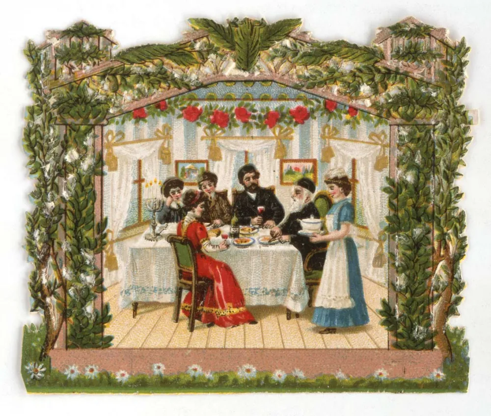 Colorful wafer picture showing a family eating and celebrating in the sukkah.