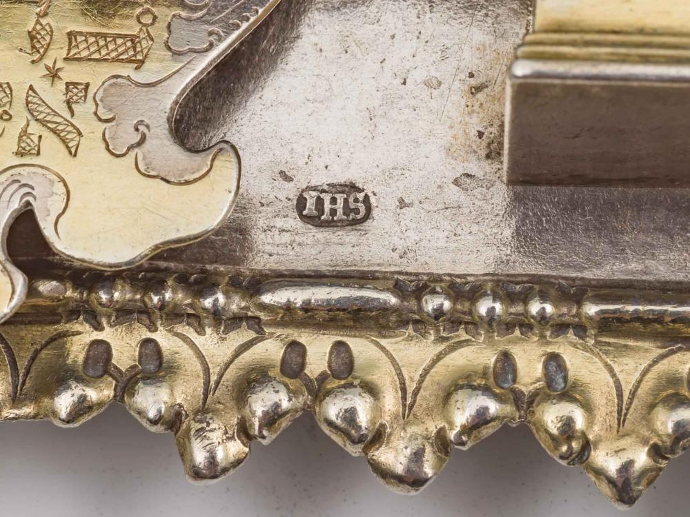 Detail of silver part-gilt Torah shield with a stamped JHS