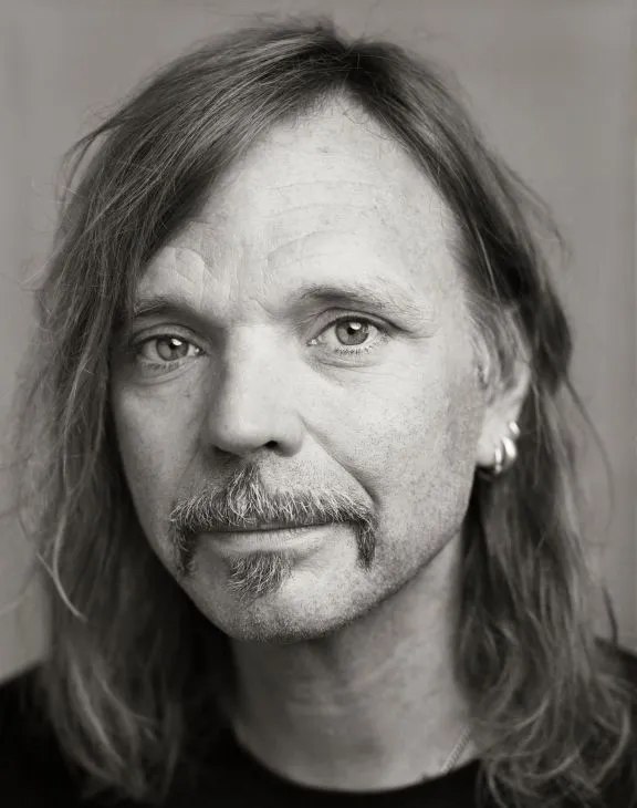 A man with long hair: The artist named Typex.