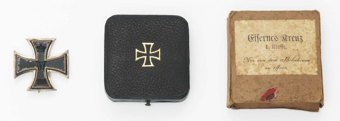 Iron Cross First Class (left), black case (center), and protective cover (right)