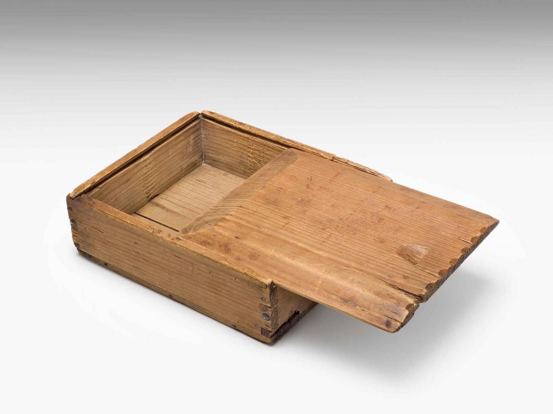 Wooden box with lid slid open