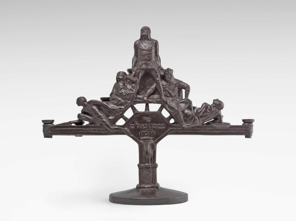  Metal candlesticks with figures and Hebrew script