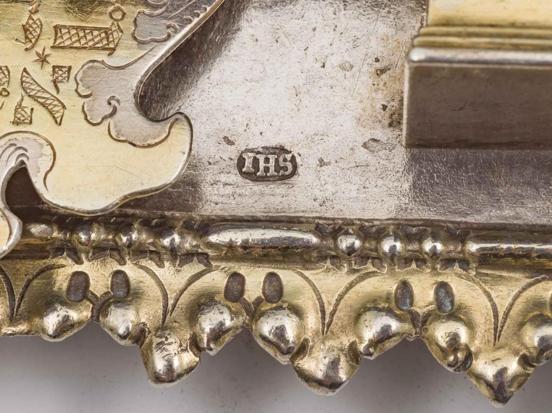 Detail of silver part-gilt Torah shield with a stamped JHS