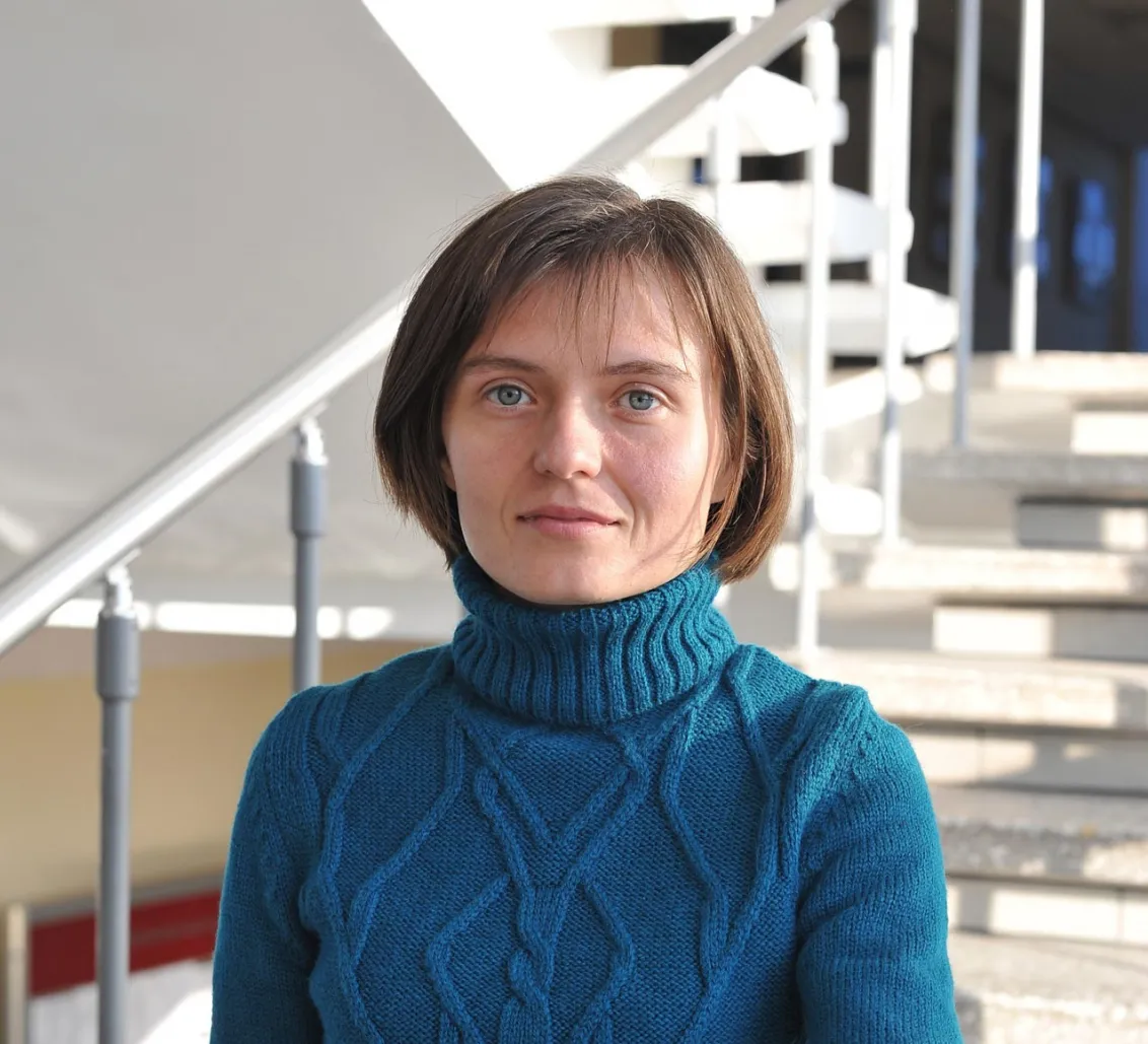 Portrait of Tetiana Portnova in a stairwell.