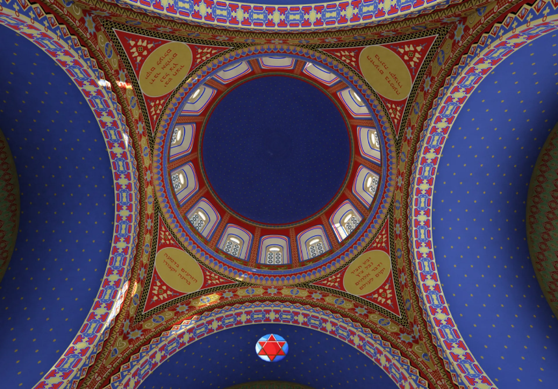Das Bild zeigt eine Kuppel einer Synagoge von innen. Der gr&ouml;&szlig;te Teil der Decke ist blau, die verschiedenen Ornamente sind gelb und rot. 