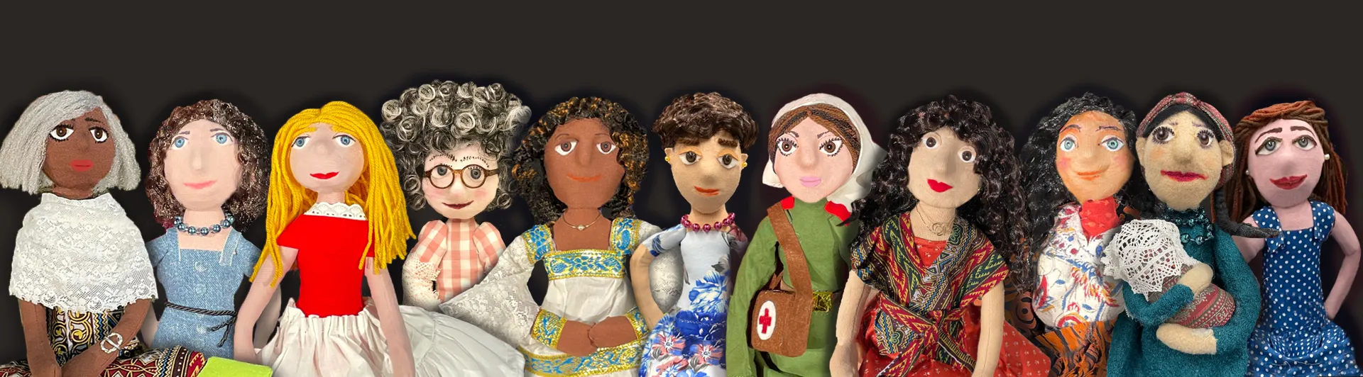 Eleven hand-made, diverse puppets.