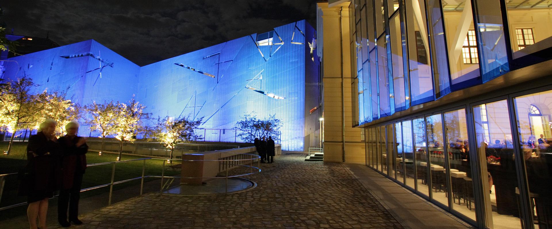 Libeskind Building and the Glass Courtyard at night (illuminated by blue light)