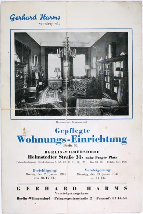 Old advertisement for an auction house. It shows the furnishings of a gentleman's study. 