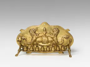  Golden Hanukkah candlestick with decorations.