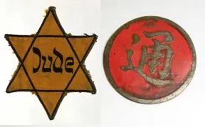 A yellow fabric patch with the word Jew on it. Next to it is a red metal badge with Chinese characters. 