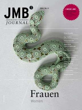 Cover Journal 11, the cover is an image of a snake with a green crochet pattern covering the entire snakes body