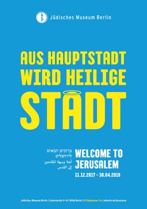 Poster with &ldquo;The capital city becomes the holy city&rdquo; written on it. The final &ldquo;a&rdquo; has a halo over it.