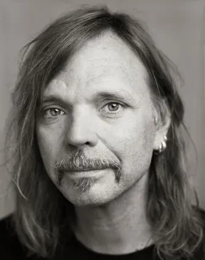 A man with long hair: The artist named Typex.
