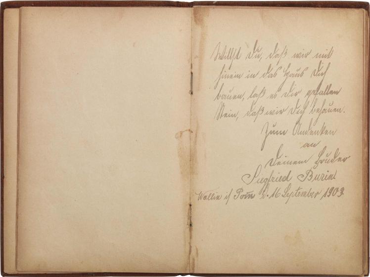 Open double-page with handwritten entry on the right side