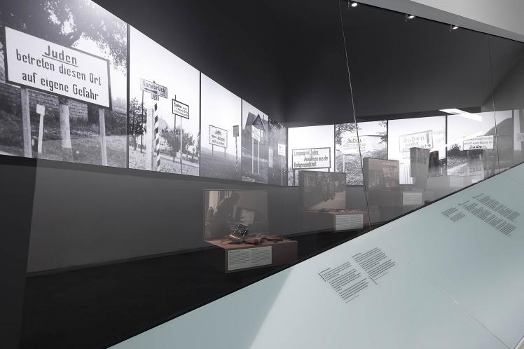 Photography: View into a showcase with photographies of anti-Semitic signs 
