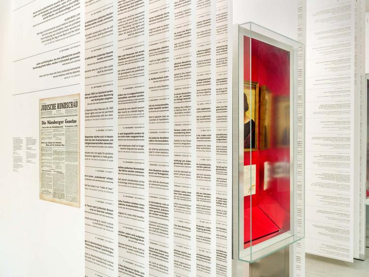 Closely juxtaposed large banners printed with regulations in an exhibition room