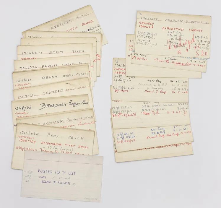 Two spread-out stacks of labelled index cards