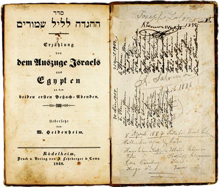 Cover of a Hebrew-German edition of the Haggadah with handwritten entries on the inside flaps