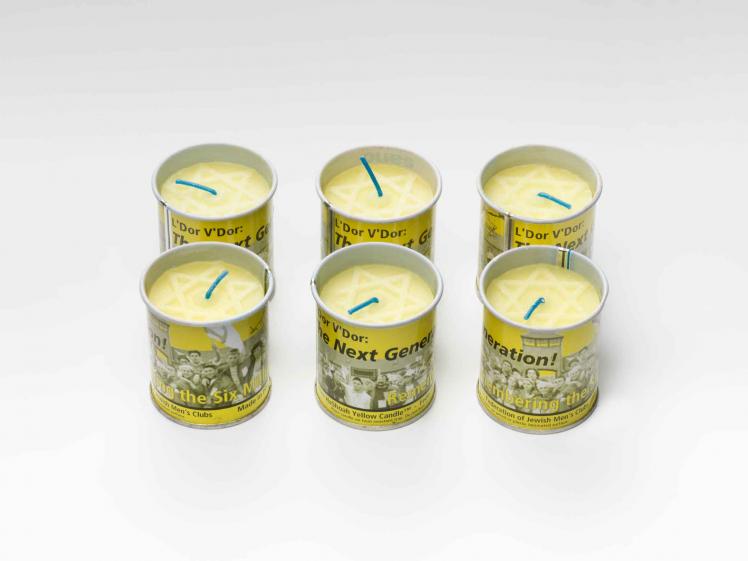 Six yellow candles with, a pale Magen Daved on top, in yellow tin cans